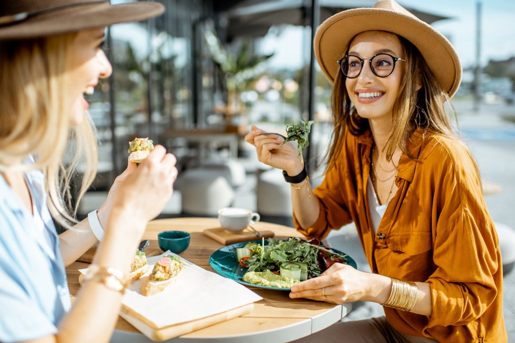 Two ladies eating healthy food