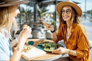 Two ladies eating healthy food